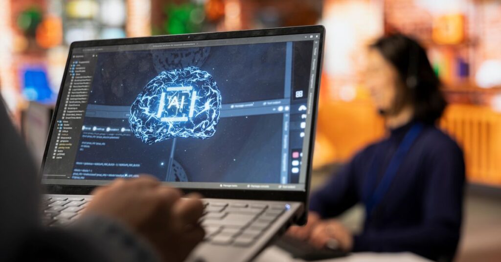 Profissional utiliza notebook com interface de inteligência artificial, simbolizando a adoção de IA no Brasil.